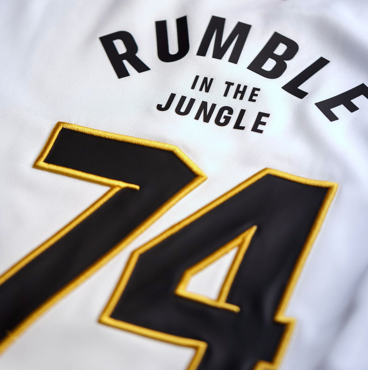 Close-up of the GOAT SKINS Muhammad Ali limited edition collectible jersey featuring Rumble in the Jungle and number 74 detail